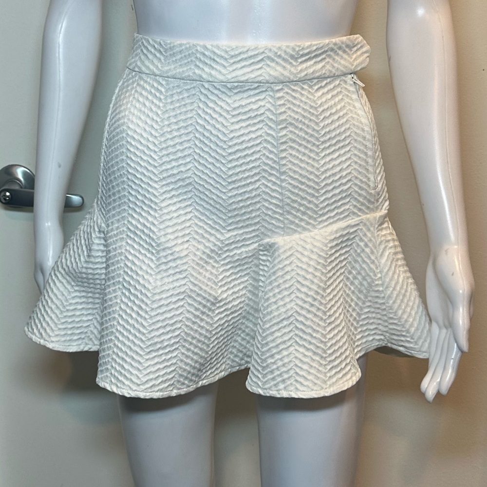 White textured peplum skirt